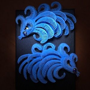 plastic faux feather clip ons from West Germany